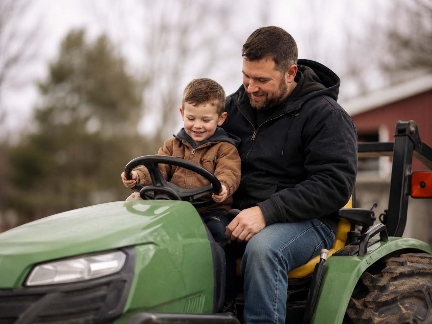 Dad and son smiling together outdoors